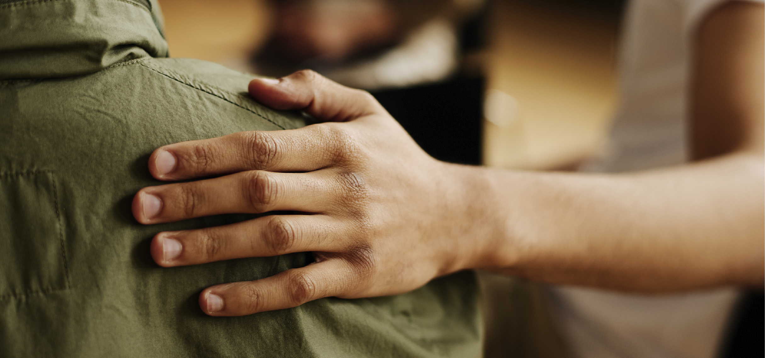 Two men studying books in a library.